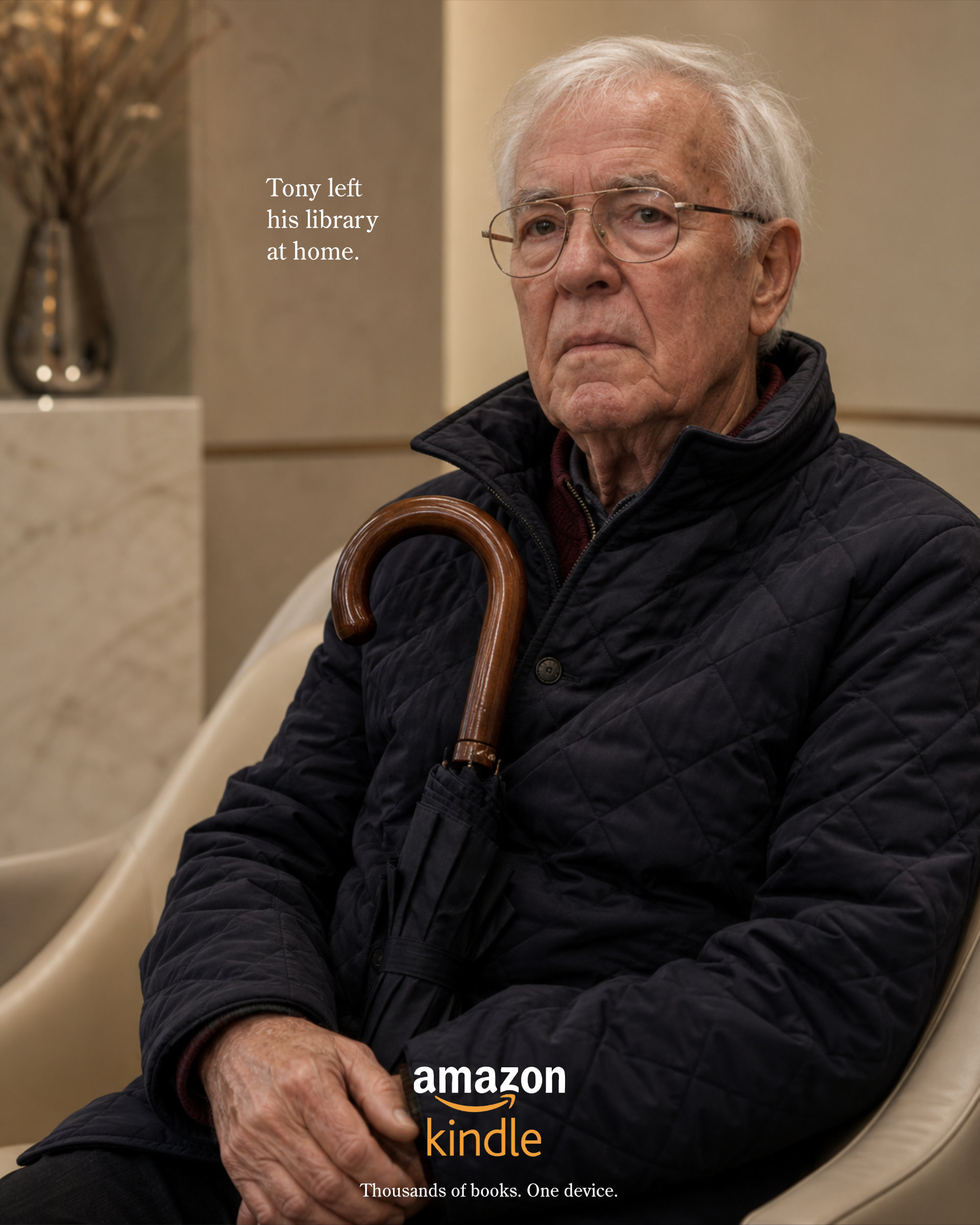 Amazon Kindle ad showing an older man with glasses and an umbrella sitting on a bench or waiting area looking sad with the headline 'Tony left his library at home.' and tagline 'Thousands of books. One device.'