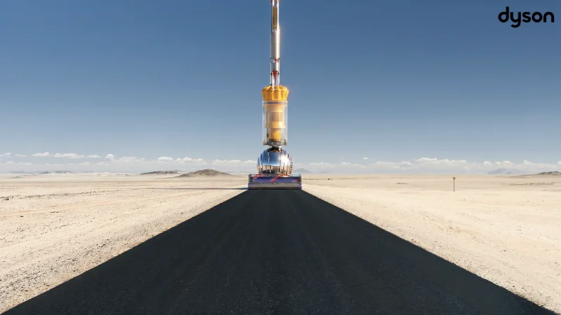 Dyson ad showing a 300-foot tall vacuum cleaner clearing debris from a desert highway.